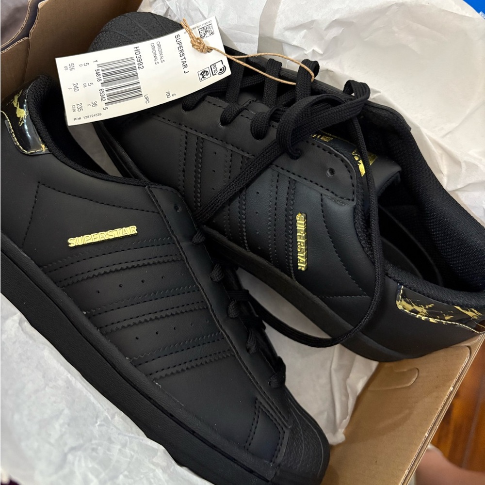 Adidas Superstar Black and Gold Sneakers